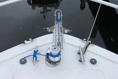 Slide: The Image of Bow of 2003 Viking 50 Open boat with anchor winch and blue rope. - 6