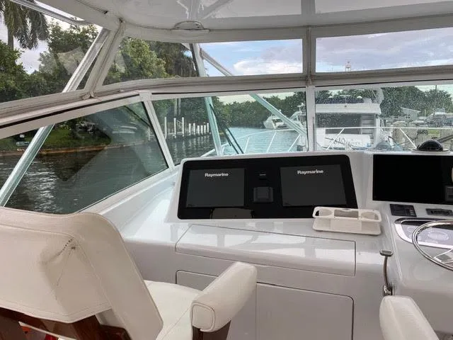 Slide: The Image of Cockpit view of a 2003 Viking 50 Open yacht with Raymarine navigation systems. - 8