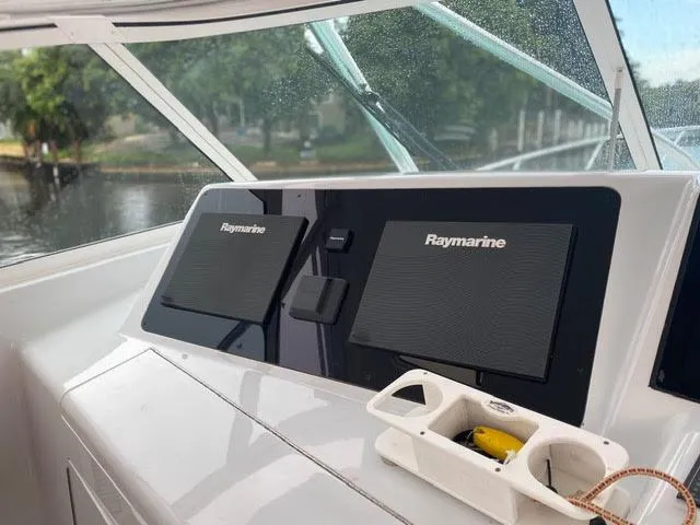 Slide: The Image of 2003 Viking 50 Open boat helm with Raymarine navigation system. - 9