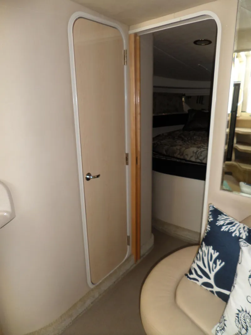 Slide: The Image of Interior of the 2003 Sea Ray 380 Sundancer with a door and seating area. - 33