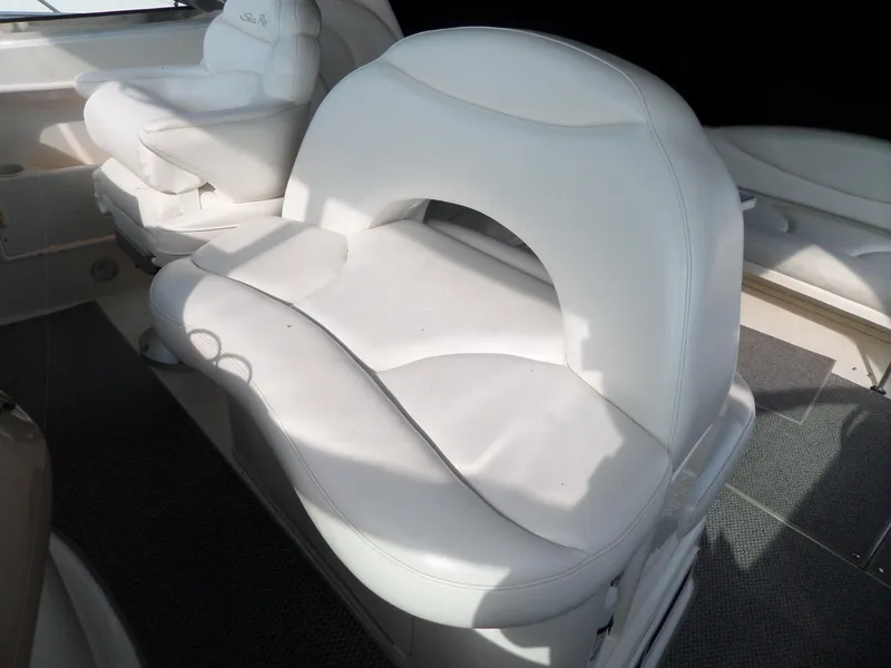 Slide: The Image of White leather seating in a 2003 Sea Ray 380 Sundancer. - 9