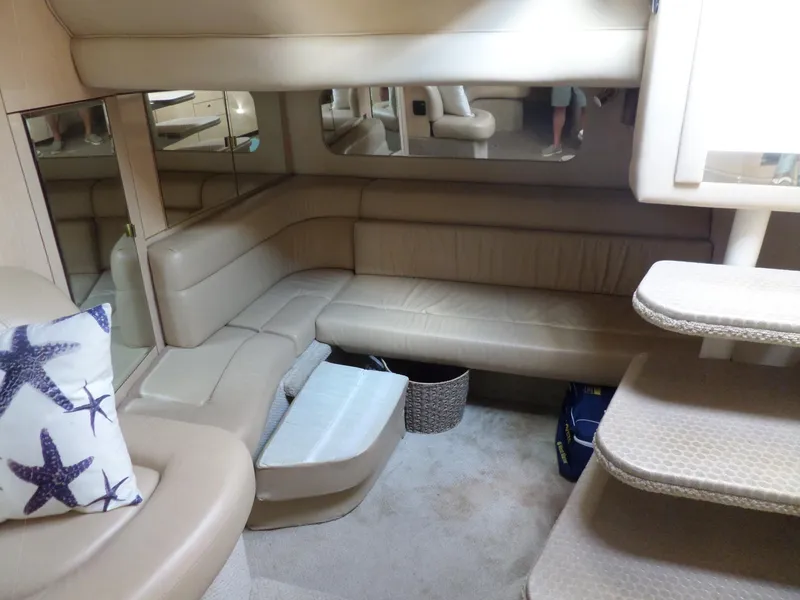 Slide: The Image of Interior of the 2003 Sea Ray 380 Sundancer with beige sofa and stairs. - 27