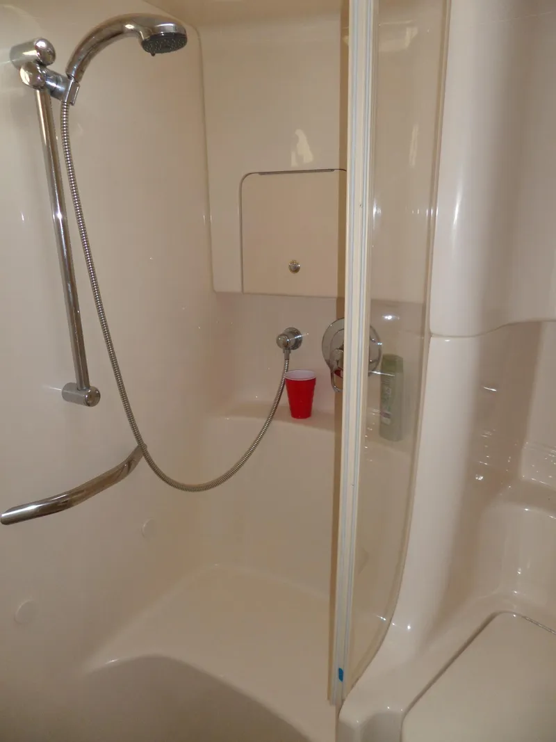 Slide: The Image of Shower in a 2003 Sea Ray 380 Sundancer with handheld showerhead and glass partition. - 51