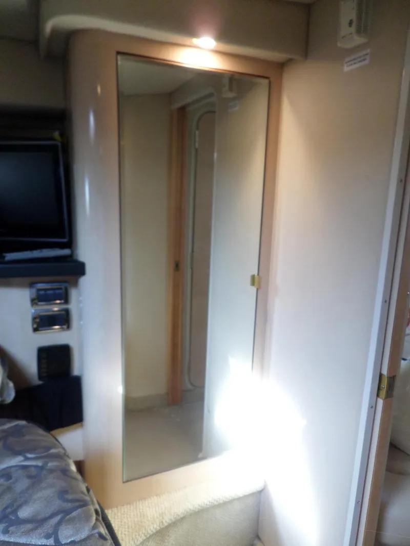 Slide: The Image of Interior of the 2003 Sea Ray 380 Sundancer with a mirror and TV. - 48