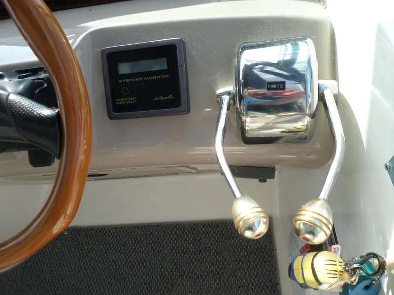 Slide: The Image of Close-up of the control console with two levers and a system monitor. - 15