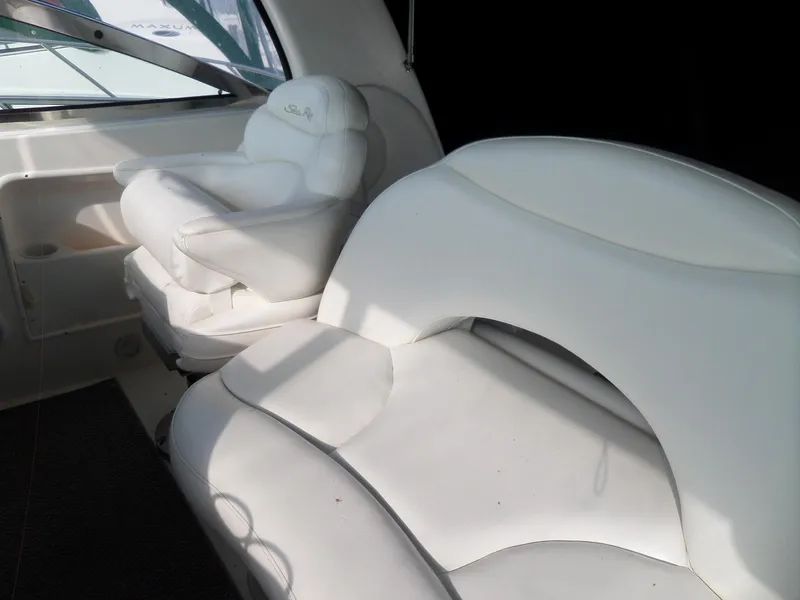 Slide: The Image of Interior of the 2003 Sea Ray 380 Sundancer with white leather seating. - 8