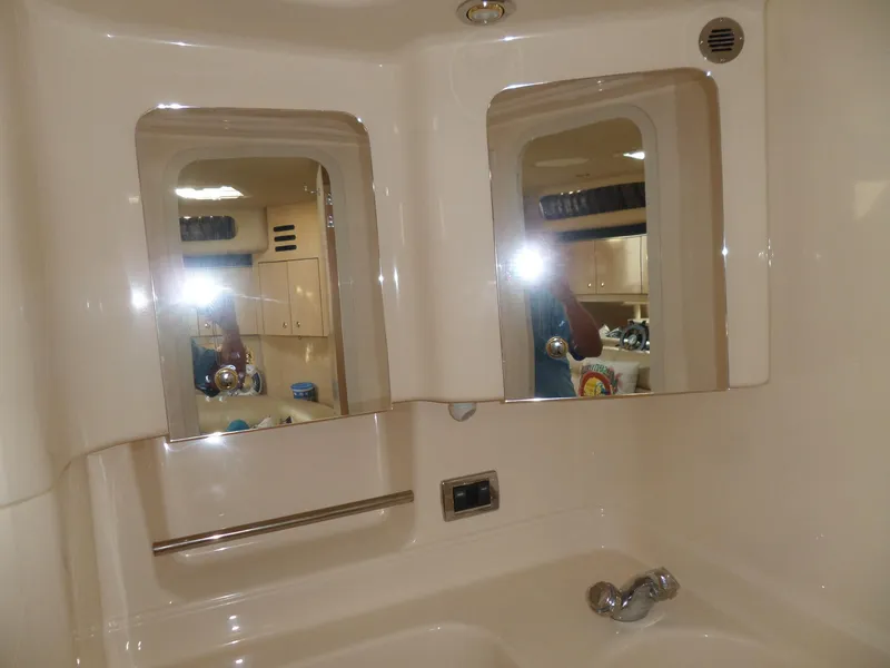 Slide: The Image of Bathroom in 2003 Sea Ray 380 Sundancer with mirrors and sink. - 53
