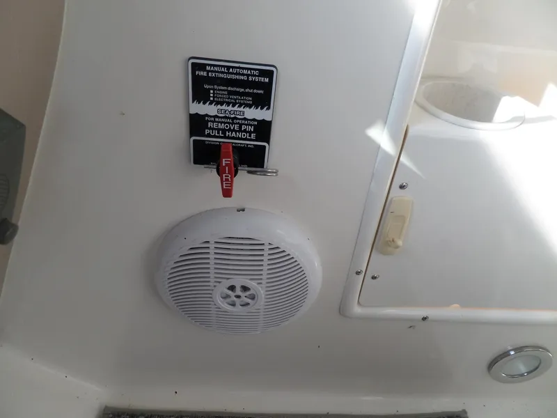 Slide: The Image of A speaker and fire extinguisher handle aboard a 2003 Sea Ray 380 Sundancer. - 16