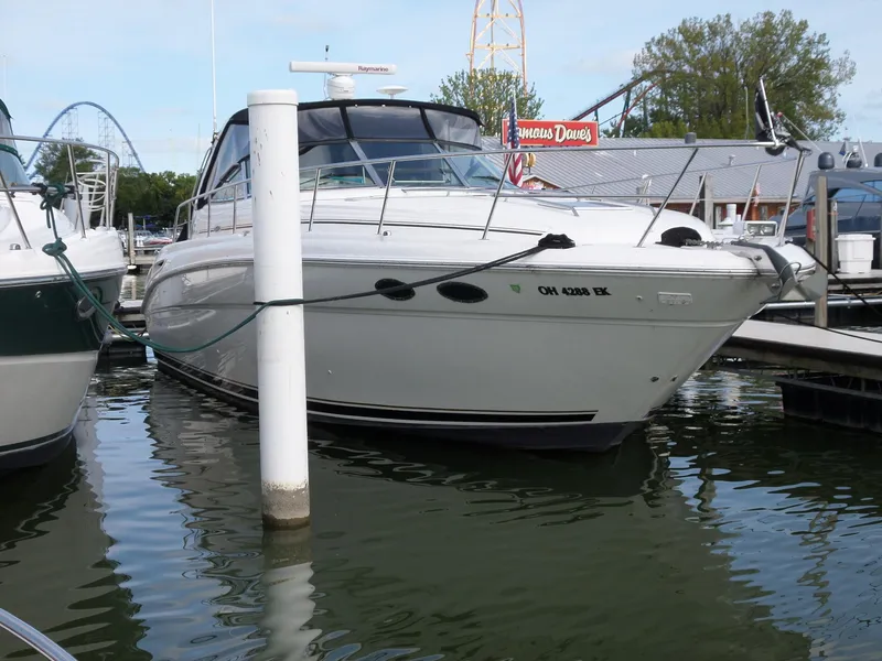 Slide: The Image of A 2003 Sea Ray 380 Sundancer docked in the water. - 0