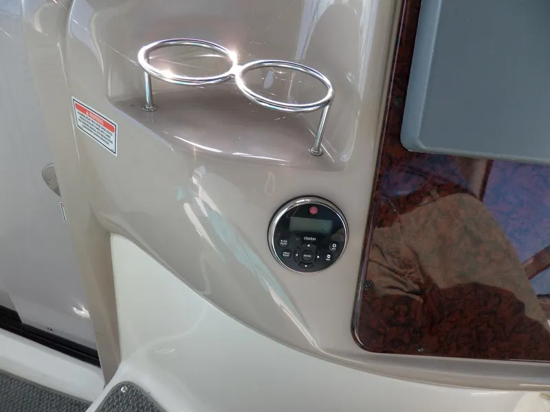 Slide: The Image of Close-up of a boat console area with two cup holders and a control panel. - 20