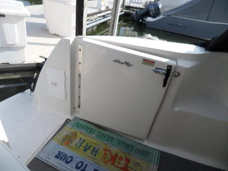 Slide: The Image of View of a 2003 Sea Ray 380 Sundancer cockpit, featuring a door and a mat. - 23