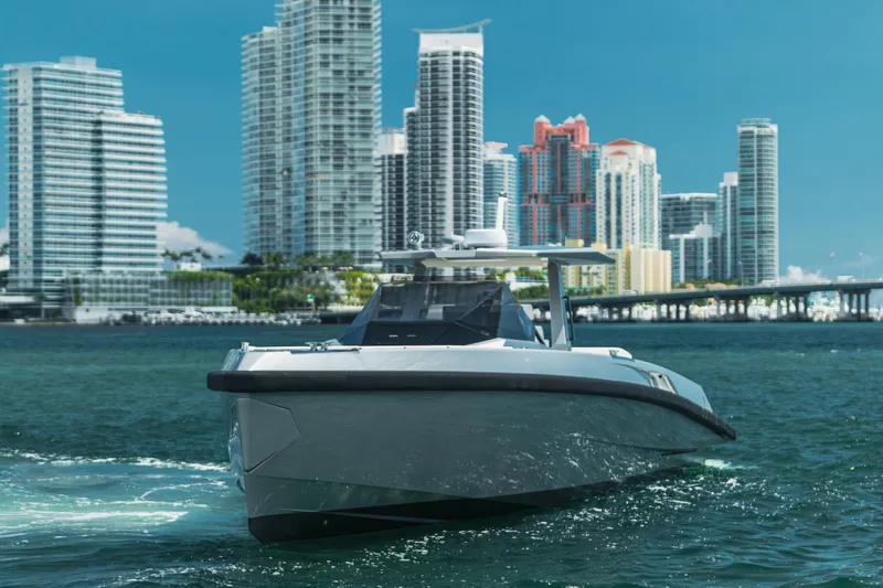 Slide: The Image of 2021 Wally 48 WALLYTENDER X yacht cruising near city skyline. - 3