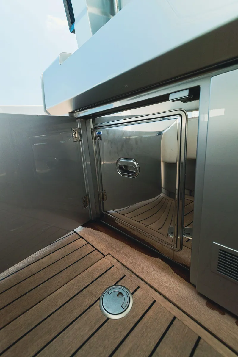 Slide: The Image of 2021 Wally 48 WALLYTENDER X yacht interior with stainless steel storage compartment. - 20