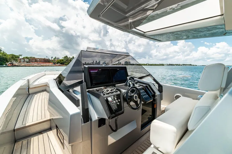 Slide: The Image of 2021 Wally 48 WALLYTENDER X luxury yacht cockpit with modern controls and ocean view. - 8