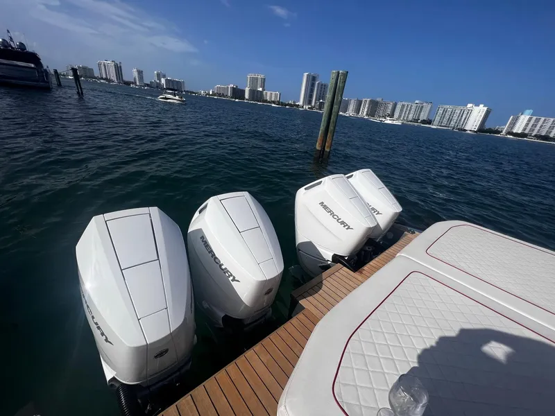 Slide: The Image of 2021 Wally 48 WALLYTENDER X with Mercury outboard engines docked in a marina. - 28