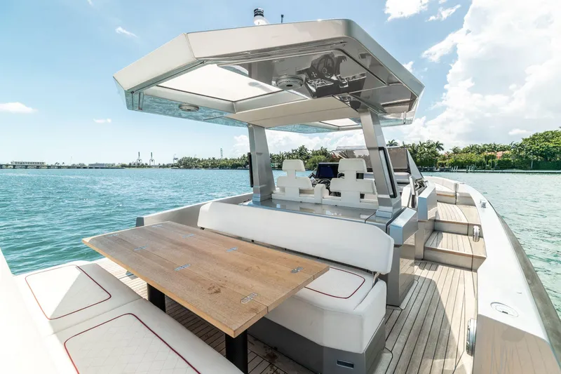 Slide: The Image of 2021 Wally 48 WALLYTENDER X luxury yacht with spacious seating and dining area. - 11