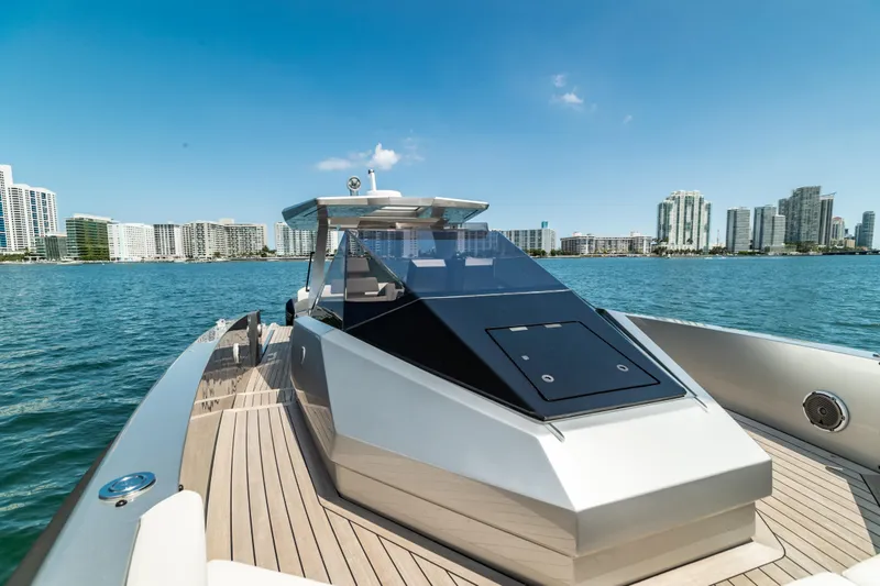 Slide: The Image of 2021 Wally 48 WALLYTENDER X luxury yacht on calm waters with city skyline. - 6