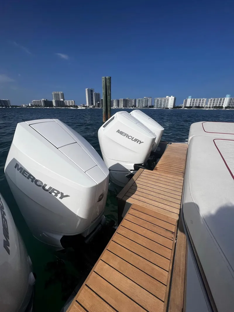 Slide: The Image of 2021 Wally 48 WALLYTENDER X with Mercury outboard engines docked by the water. - 29