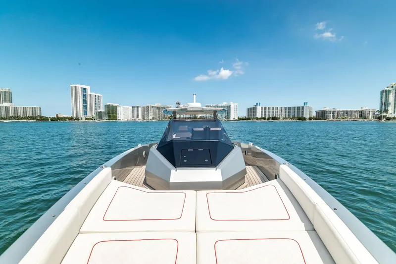 Slide: The Image of 2021 Wally 48 WALLYTENDER X luxury yacht on calm waters with city skyline. - 4