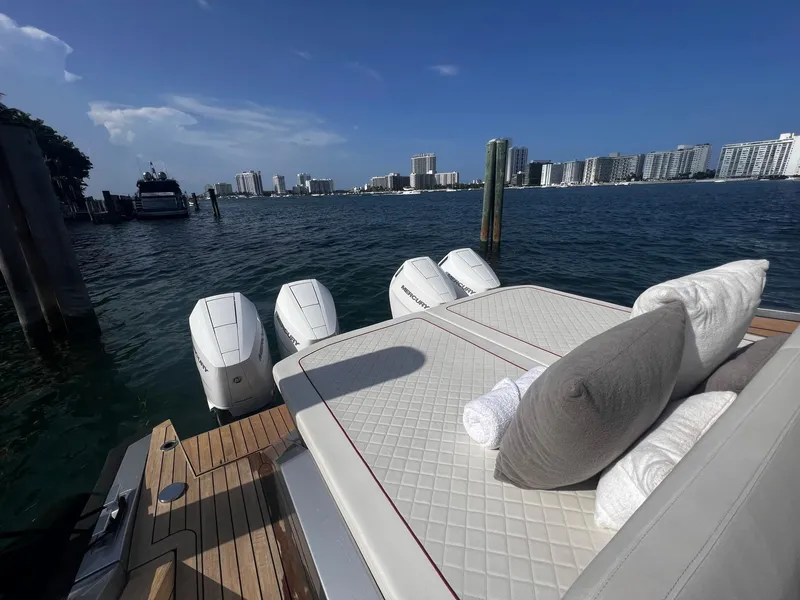 Slide: The Image of 2021 Wally 48 WALLYTENDER X luxury yacht docked with city skyline in background. - 27
