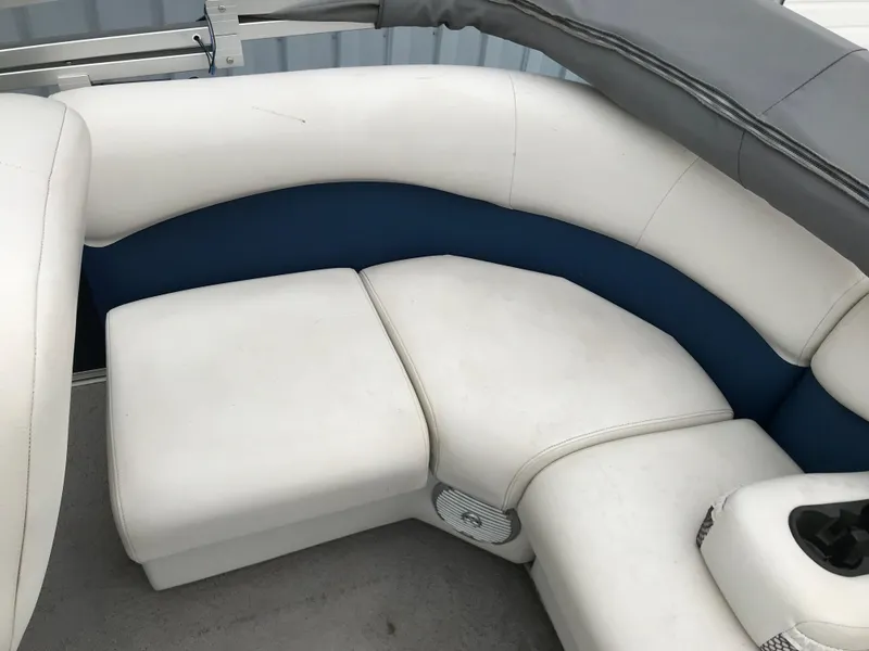 Slide: The Image of 2015 Palm Beach Ultra Sport 220 boat interior with white and blue seating. - 12