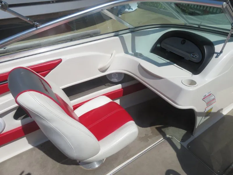 Slide: The Image of Interior of a 2006 Sea Ray 205 Sport boat with red and white seating. - 4