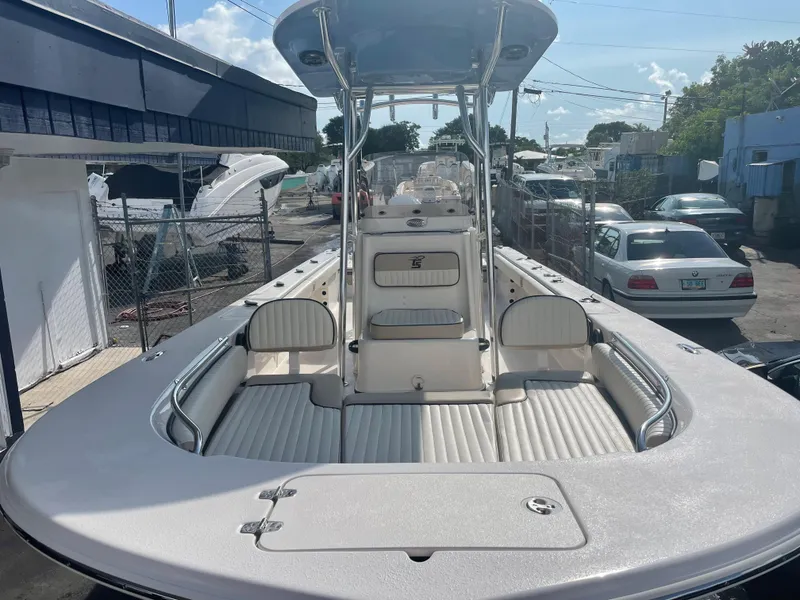 Slide: The Image of 2024 Carolina Skiff 26 Ultra Elite boat, spacious deck, docked outdoors. - 14