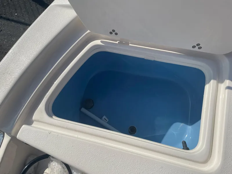 Slide: The Image of Livewell compartment on a 2024 Carolina Skiff 26 Ultra Elite boat. - 21