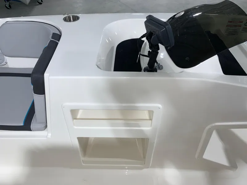 Slide: The Image of 2024 Bayliner Element M17 boat interior with seating and console. - 10