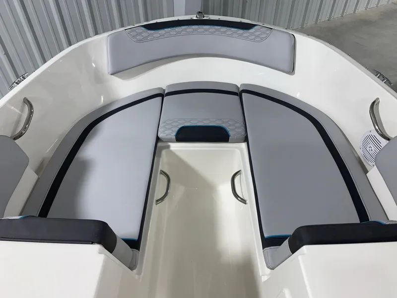Slide: The Image of 2024 Bayliner Element M17 boat interior with gray cushioned seating. - 12