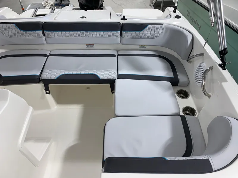 Slide: The Image of 2024 Bayliner Element M17 boat interior with cushioned seating and cup holders. - 8