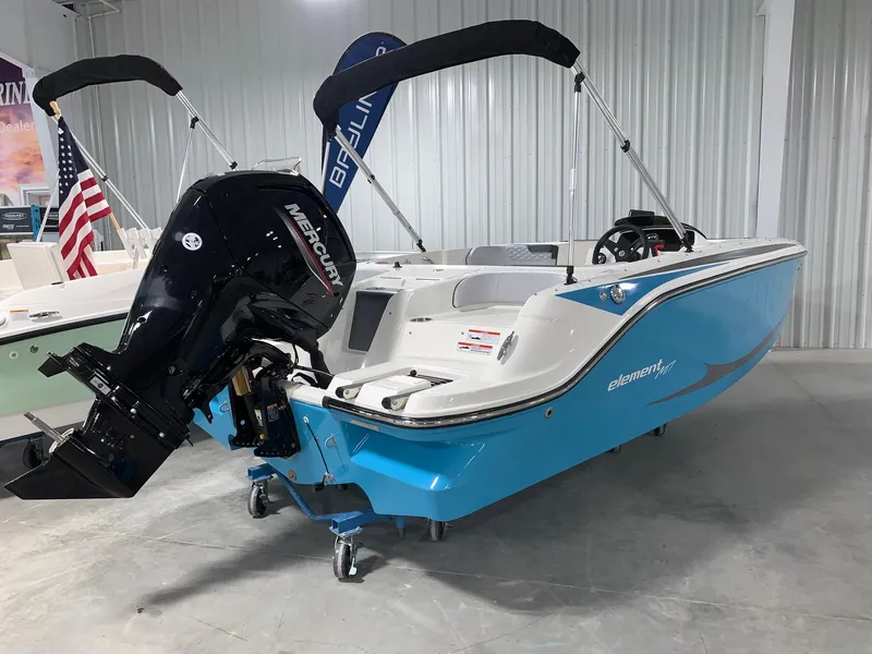 Slide: The Image of 2024 Bayliner Element M17 boat with Mercury outboard motor in showroom. - 1