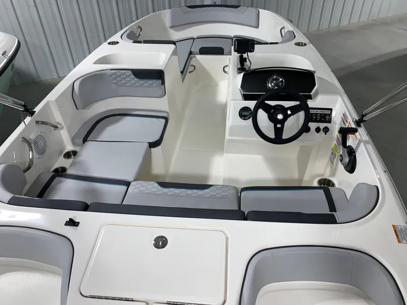 Slide: The Image of 2024 Bayliner Element M17 boat interior with seating and steering console. - 4