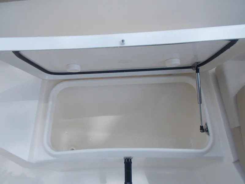 Slide: The Image of 2025 Scout 240 XSF boat storage compartment. - 10
