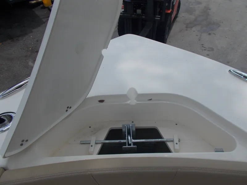 Slide: The Image of Open storage compartment on a 2025 Scout 240 XSF boat. - 11
