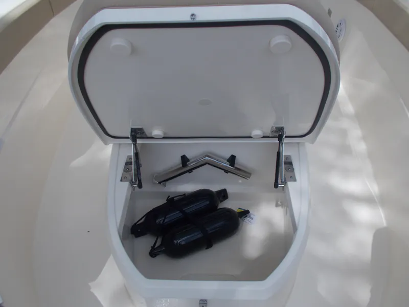 Slide: The Image of Storage compartment of 2025 Scout 240 XSF boat with fenders and accessories. - 13
