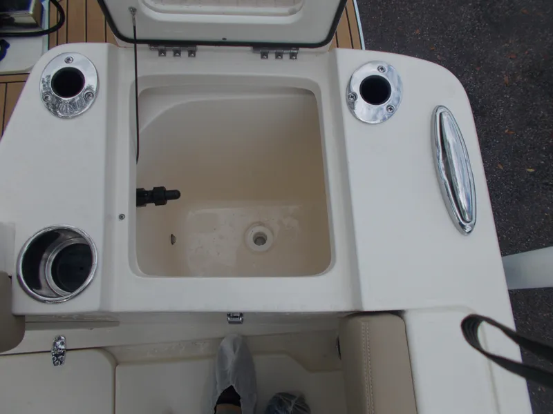 Slide: The Image of 2025 Scout 240 XSF boat livewell and rod holders. - 16