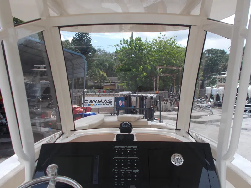 Slide: The Image of View from the helm of a 2025 Scout 240 XSF boat at a marina. - 3