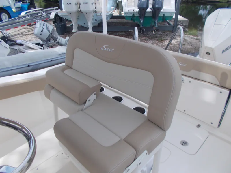 Slide: The Image of 2025 Scout 240 XSF boat with beige and white seating. - 4