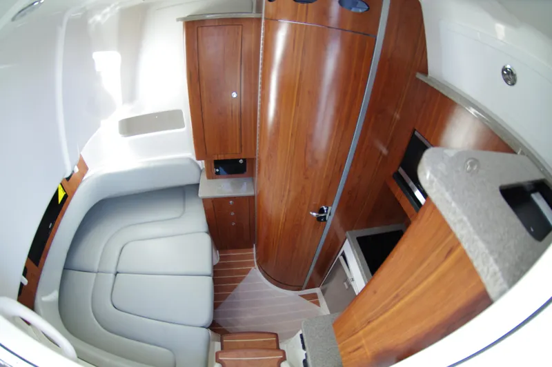 Slide: The Image of 2018 Regulator 41 Center Console cabin interior with wood finish and seating area. - 11