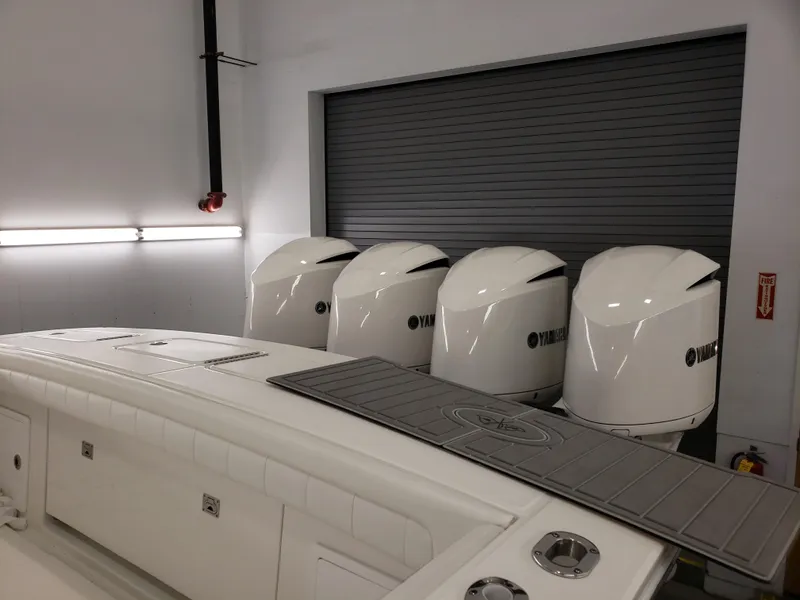 Slide: The Image of 2018 Regulator 41 Center Console with four Yamaha outboard engines in a garage. - 3