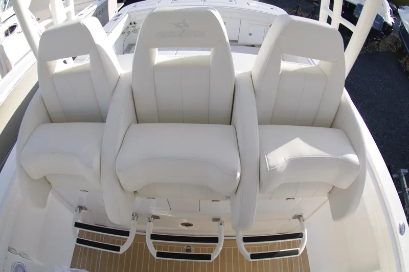 Slide: The Image of 2018 Regulator 41 Center Console boat with white cushioned seating - 6