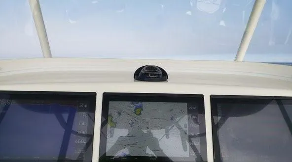 Slide: The Image of 2018 Regulator 41 Center Console dashboard with navigation screens. - 9