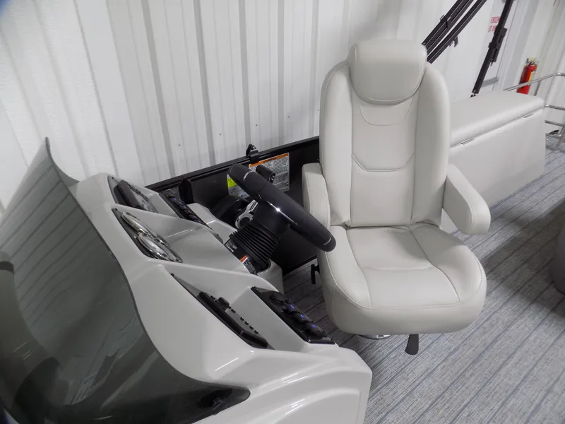 Slide: The Image of 2023 Sylvan Mirage X X3 CLZ boat interior with steering wheel and captain's chair. - 5