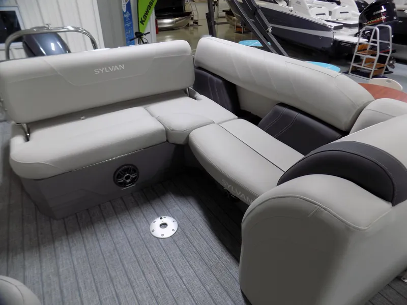 Slide: The Image of 2023 Sylvan Mirage X X3 CLZ boat interior with plush seating and modern design. - 6