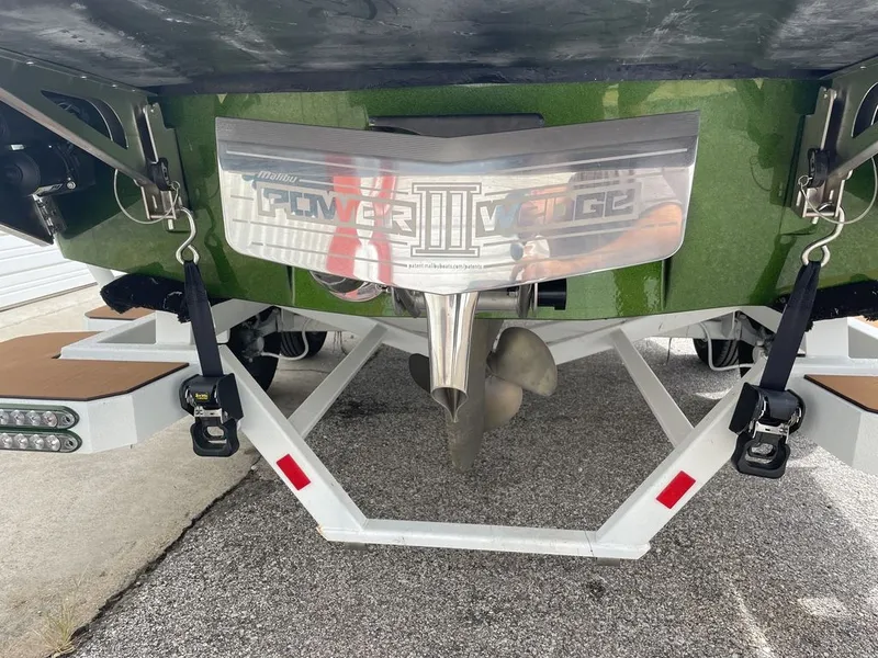 Slide: The Image of 2021 Malibu 22 LSV boat with Power Wedge III on trailer. - 3