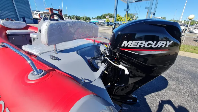 Slide: The Image of 2023 Grand Inflatables G380EF with Mercury outboard motor at marina. - 16