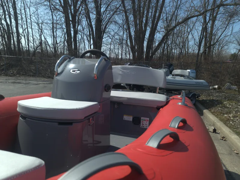Slide: The Image of 2023 Grand Inflatables G380EF red inflatable boat with steering console and seating. - 7
