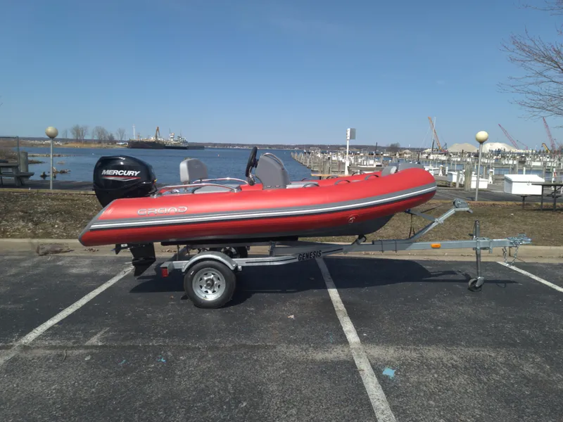 The Image of 2023 Grand Inflatables G380EF boat on trailer by waterfront. - 0