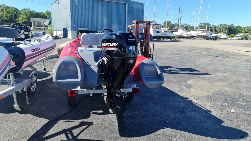 Slide: The Image of 2023 Grand Inflatables G380EF boat with Mercury 40 engine at a marina. - 11